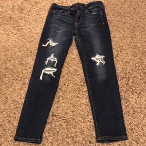 Dark blue distressed jeans